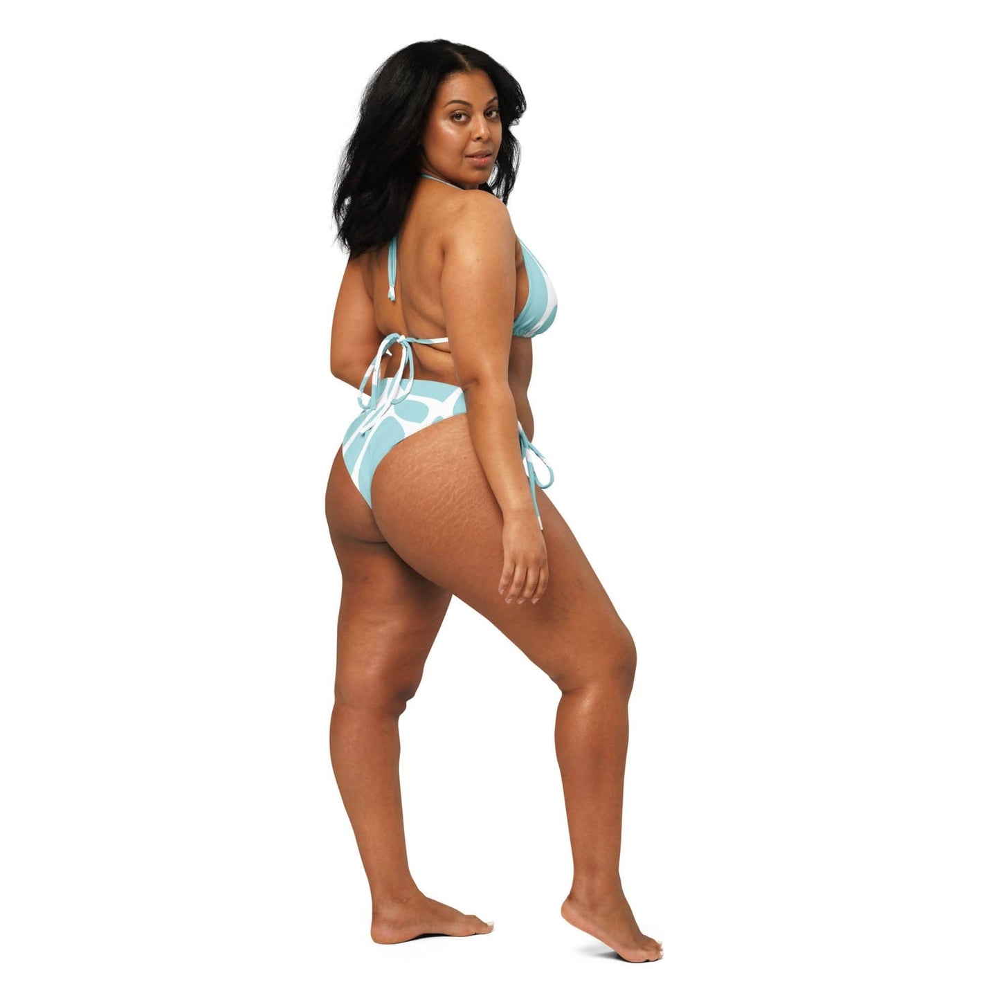 Curvy woman modeling a blue and white ethical fashion bikini with side-tie bottoms from unik.fashion