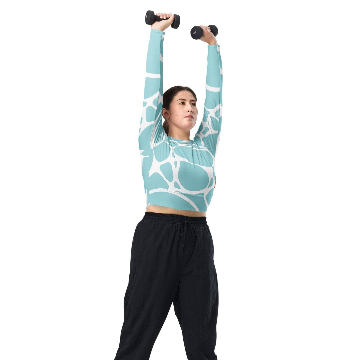 Woman lifting dumbbells wearing unik.fashion eco-friendly cropped shirt with abstract blue and white design